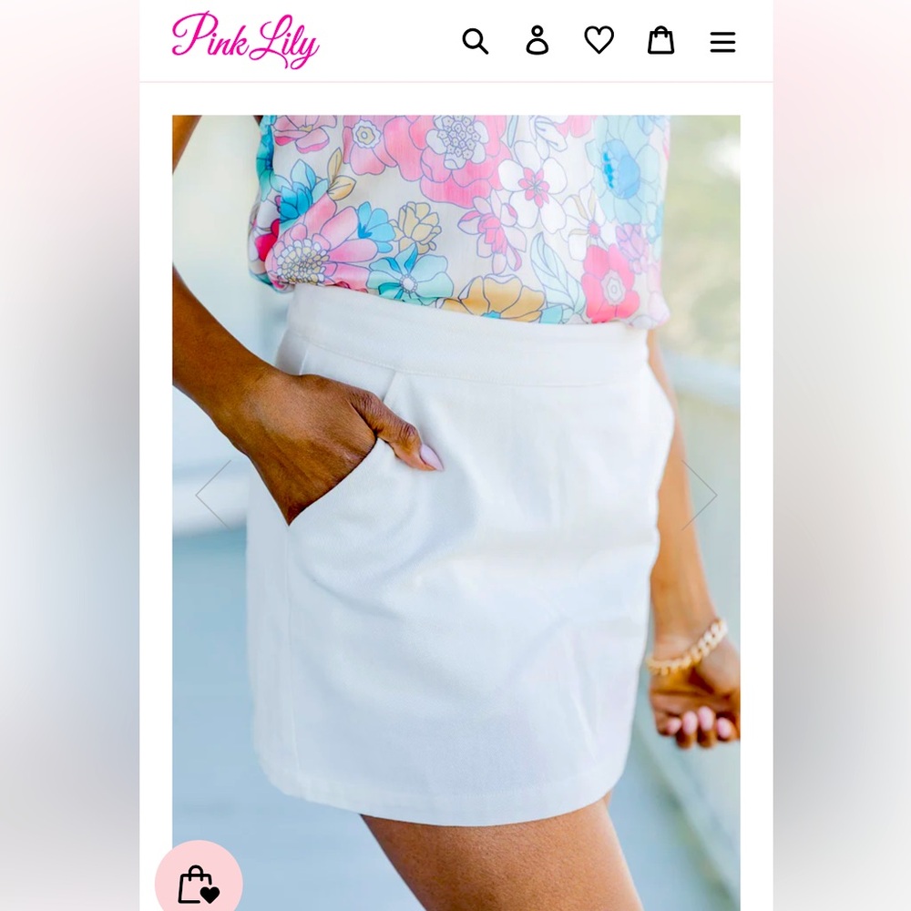 NWOT Boutique Skort. Never worn. It has pockets and shorts underneath.